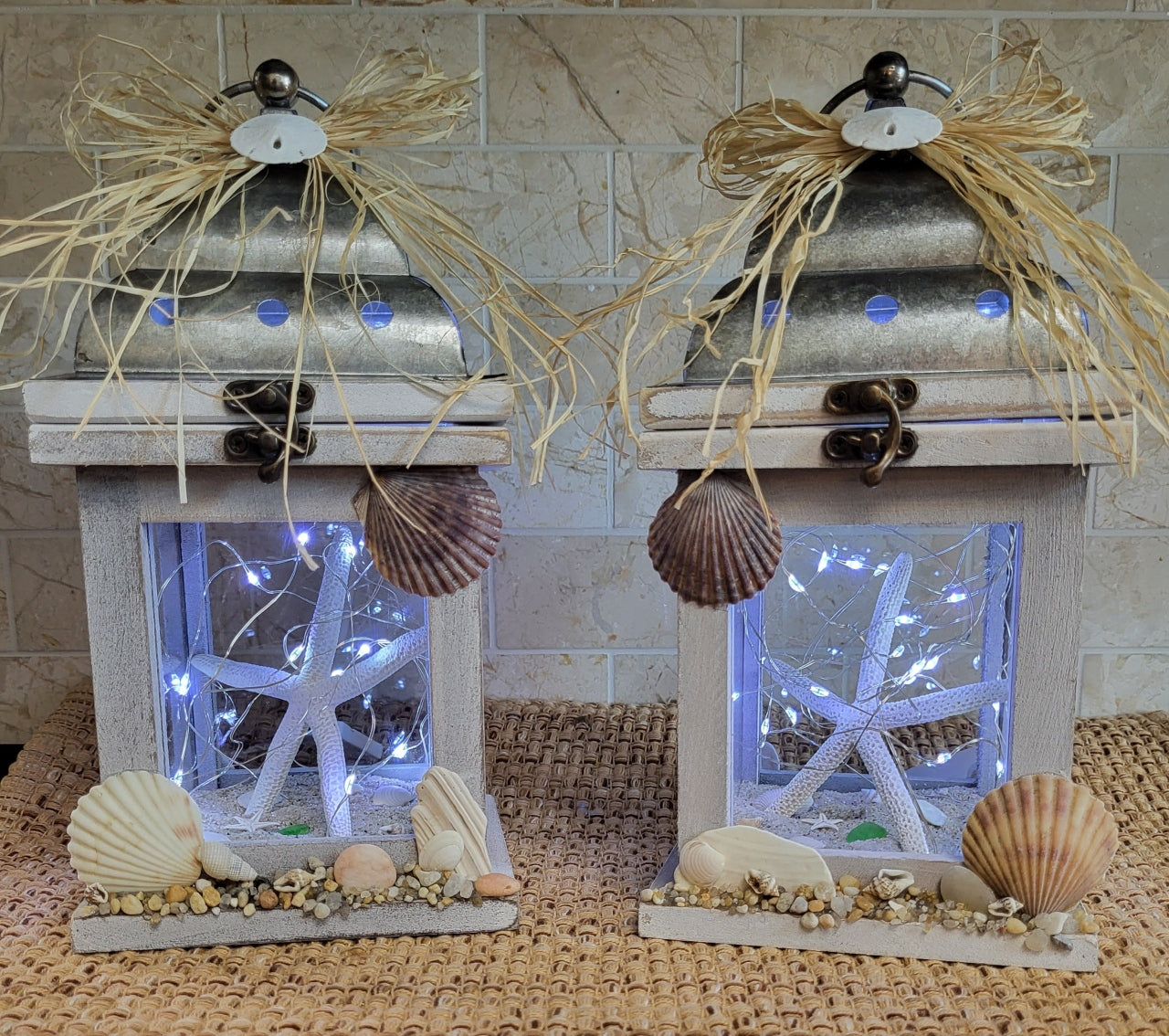 Beach-inspired lantern with sand, shells, and starfish, Jersey Shore home decor